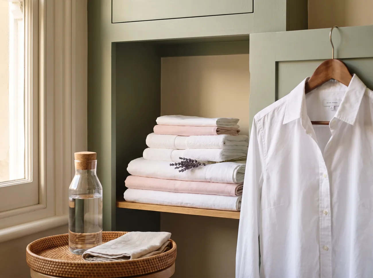 Perfectly folded linens and a pressed shirt in an elegant London home